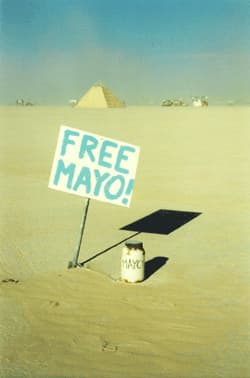 Free Mayo — a five-gallon jug of mayonnaise in the desert with a handmade sign, Burning Man 2005. Photo by Bob Marzewski.